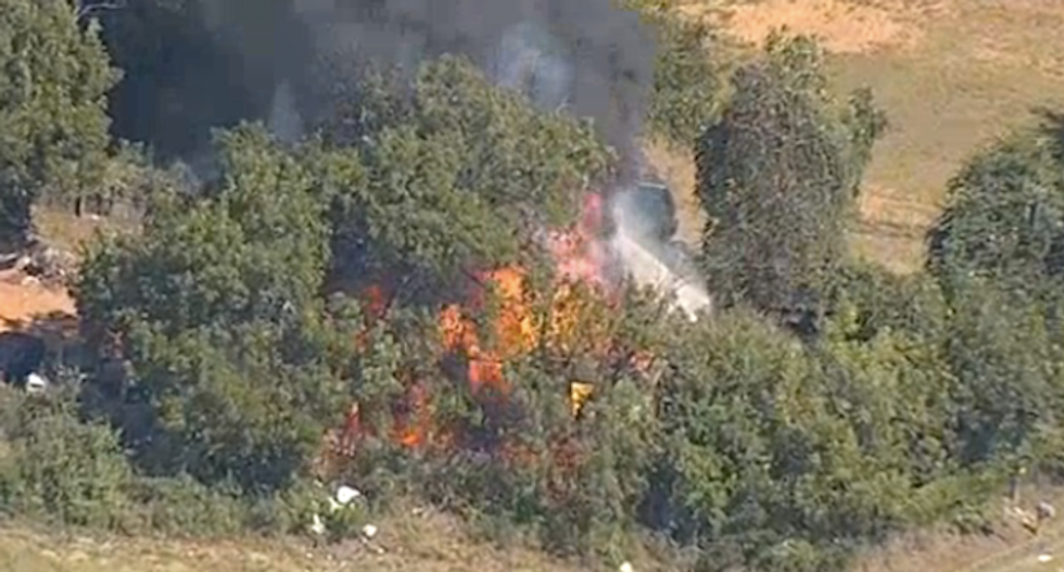 WATCH LIVE: Gunman arrested after setting fire to Texas home in police standoff