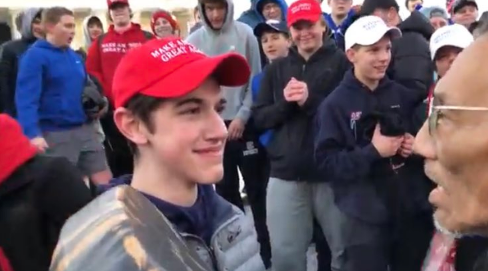 Student in Trump hat denies mocking Native American activist in videotaped encounter