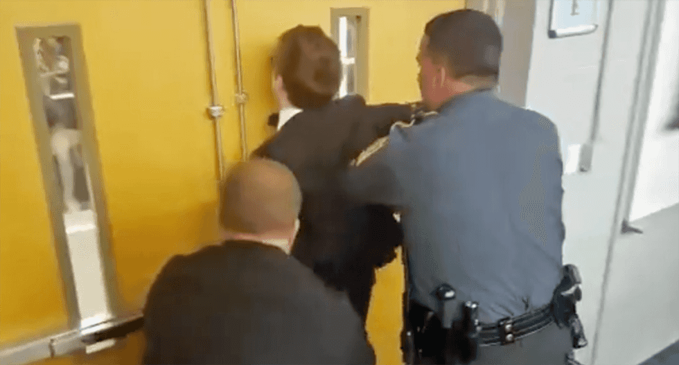 Reporter for pro-Trump site Gateway Pundit arrested for allegedly accosting a woman at white supremacist speech