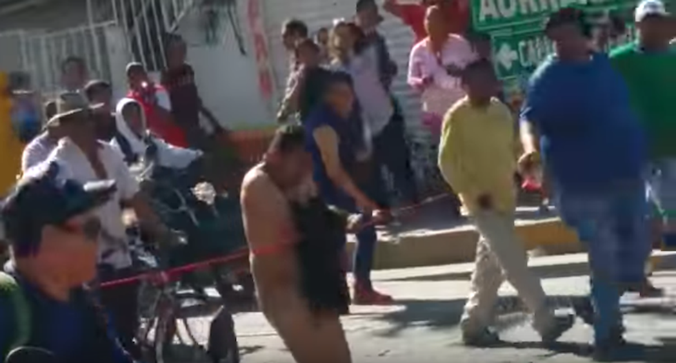 Man forced to march naked through Mexico town after he's caught looting during gas price protests