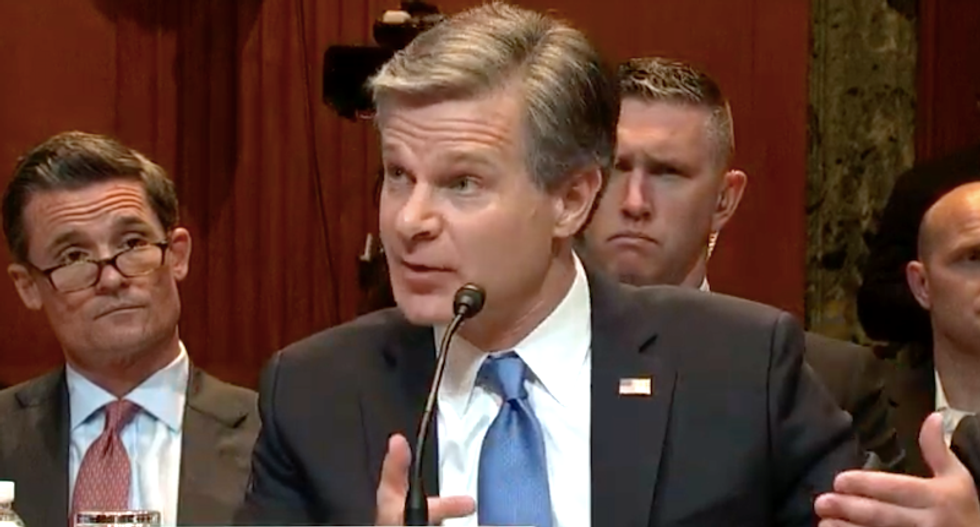 FBI director Chris Wray pushes back on Bill Barr's claims about 'spying' on the Trump campaign