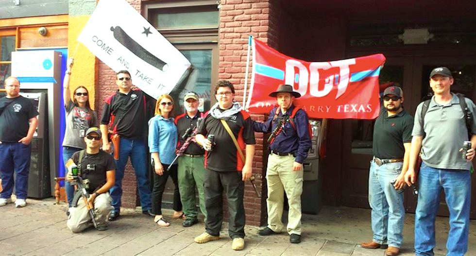 Open-carry activists mob bullet-ridden Austin police station to show guns aren't scary