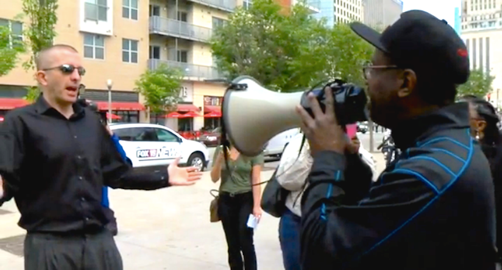 Angry white people shout down protest against 'racist' prosecution of black Ohio judge