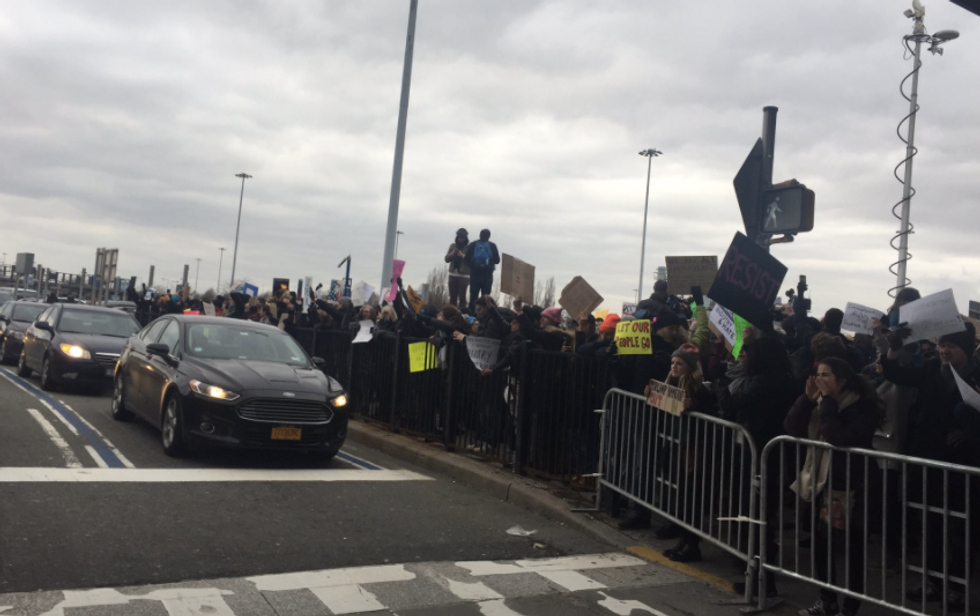 ‘Let them in!’: Protesters gather at JFK Airport to shout down Trump's 'unjust' immigrant detentions