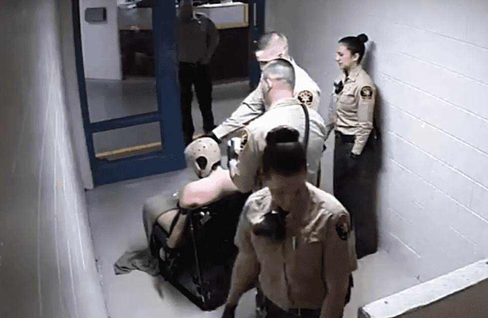 Watch: Cops laugh as mentally ill inmate strapped naked to chair for 46 hours dies