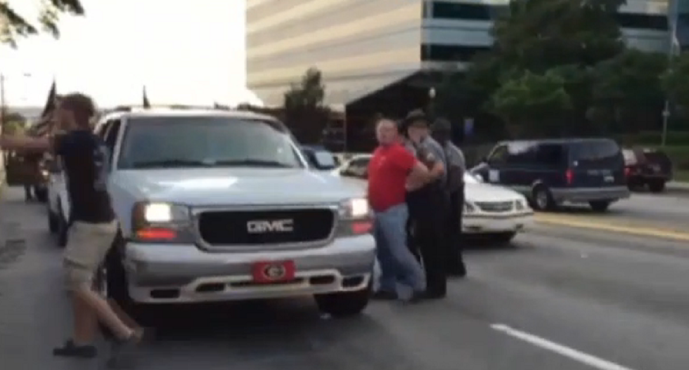 WATCH: Fistfights break out as tensions run high at South Carolina protests over Confederate flag