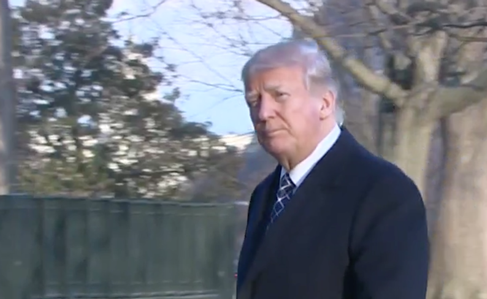 Watch Trump's lonely and silent walk of shame as he arrives at the White House on #StormySunday