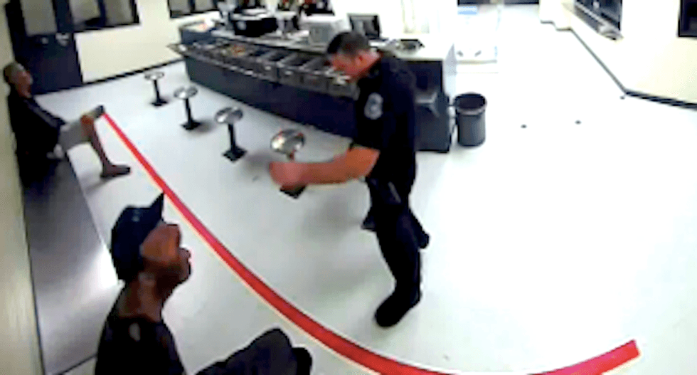 WATCH: Florida cop feeds drunken inmate like a zoo animal while barking 'dog commands'