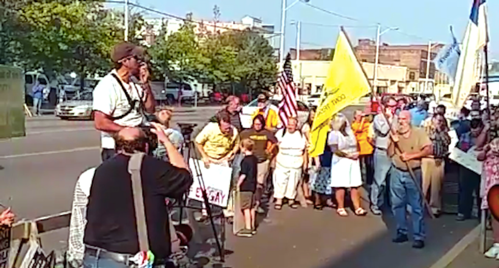 WATCH: Chaotic scenes outside courthouse as Kim Davis supporters scream at LGBT rights supporters