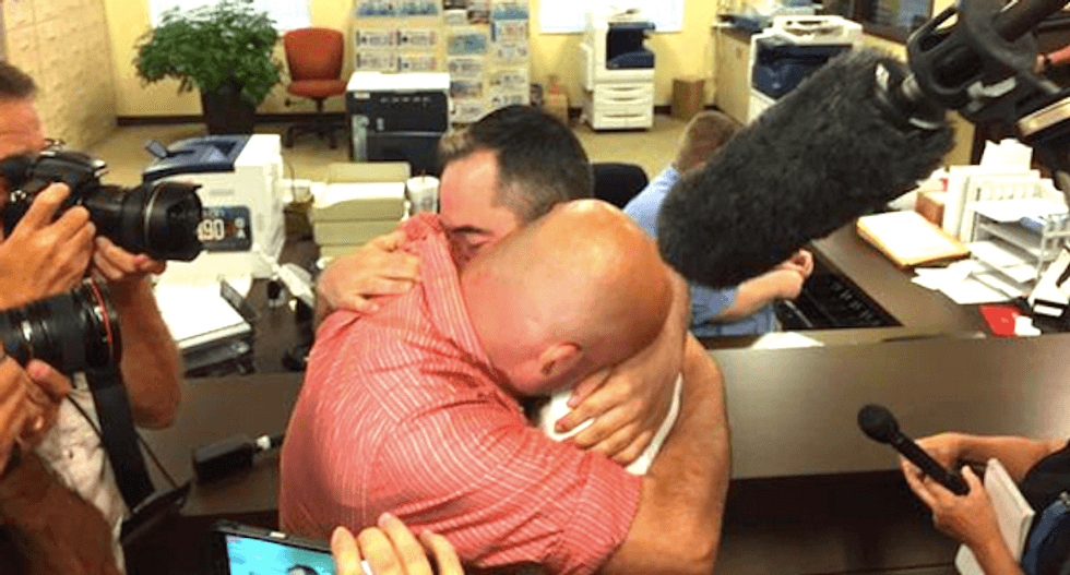 ‘Love has won’: Same-sex couple celebrates marriage with activists at Kim Davis’ office