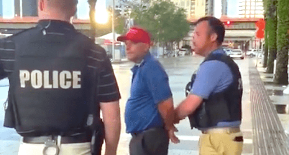 WATCH: Trump supporter arrested for smacking reporter's phone outside Orlando rally