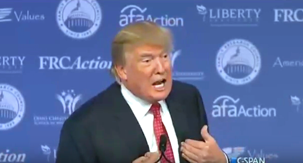 Donald Trump woos 'values voters' by waving Bible and promising to make stores say 'Merry Christmas'