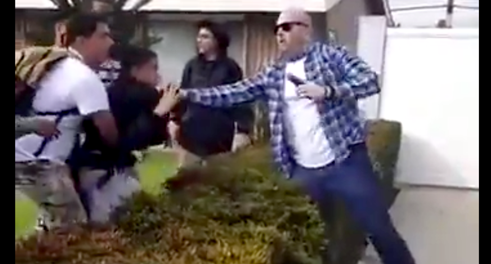 WATCH: Off-duty police officer fires gun during physical confrontation with 13-year-old boy