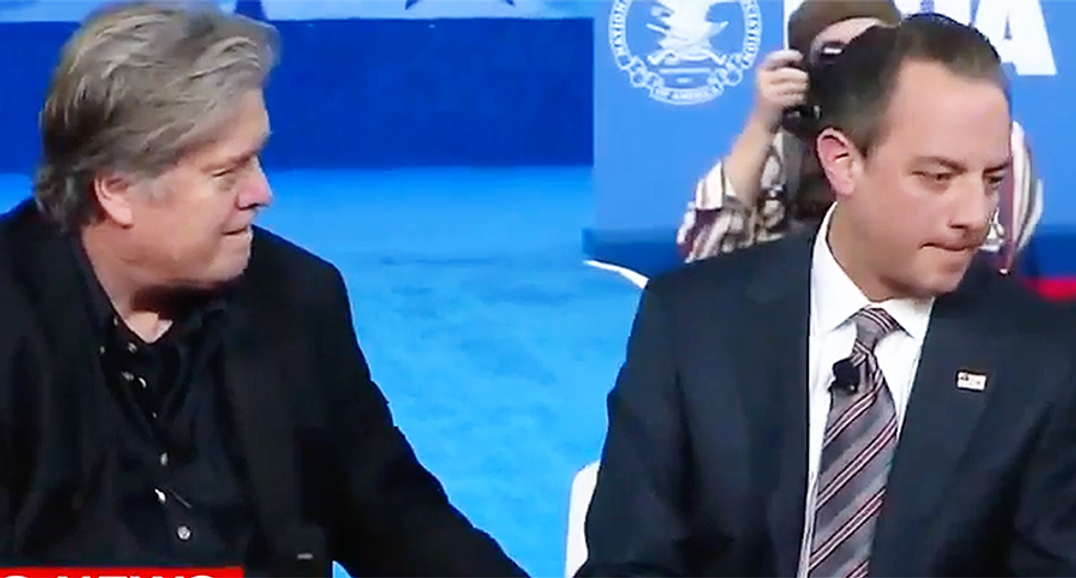 Watch Reince Preibus' cringeworthy reaction to Steve Bannon patting his leg