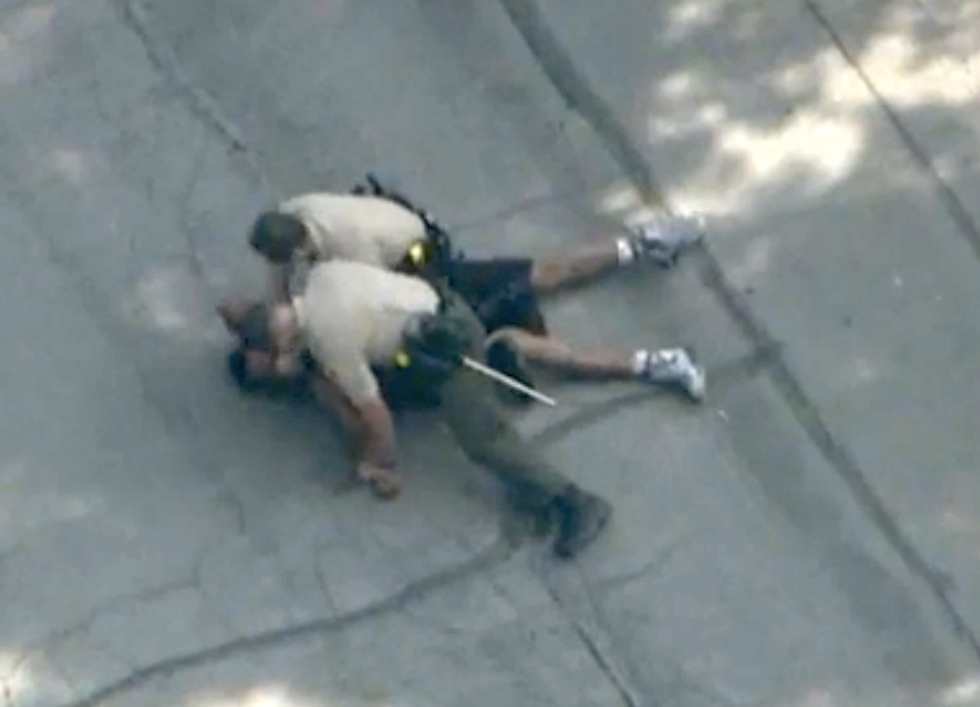 California deputy caught on live TV brutally beating unarmed black suspect