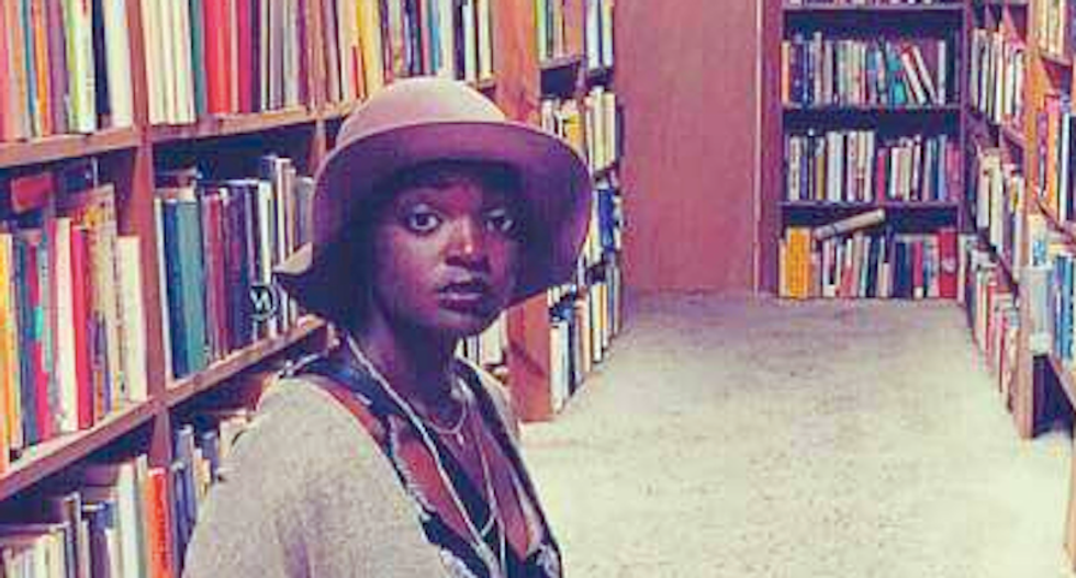 Organizers seat woman behind Trump 'because she's black' -- so she silently protests by reading her book
