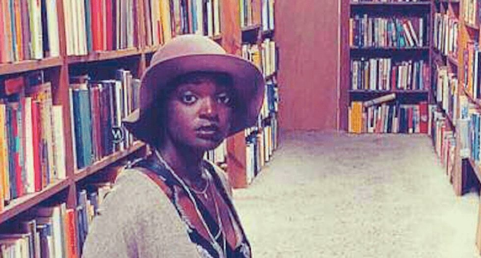 Organizers seat woman behind Trump 'because she's black' -- so she silently protests by reading her book