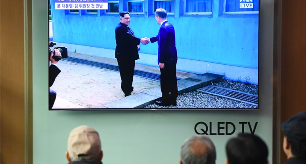 North Korean dictator Kim Jong-Un takes part in historic handshake after walking into South Korea for the first time