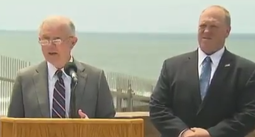 WATCH: Protester calls out 'evil' Jeff Sessions for implementing 'racist' policies during immigration press conference