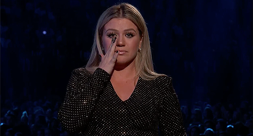 'I'm sick of moment of silence': Kelly Clarkson opens Billboard Music Awards with tearful demand for a 'moment of change'