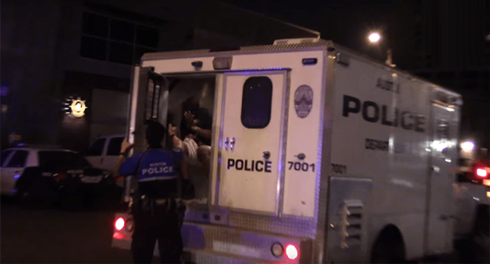 Texas cop caught on video pepper-spraying a handcuffed man in the back of a police van