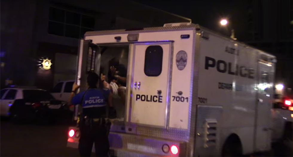 Texas cop caught on video pepper-spraying a handcuffed man in the back of a police van