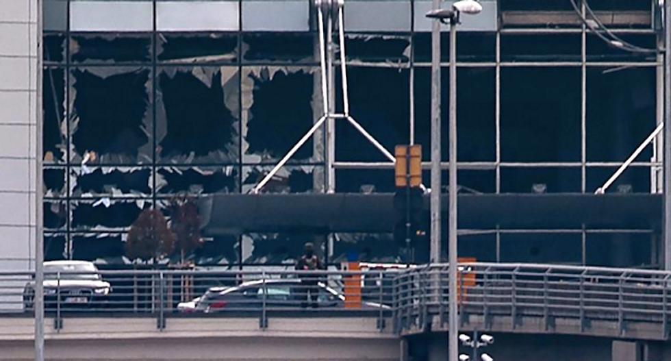 At least 26 dead as blasts rock Brussels airport and subway