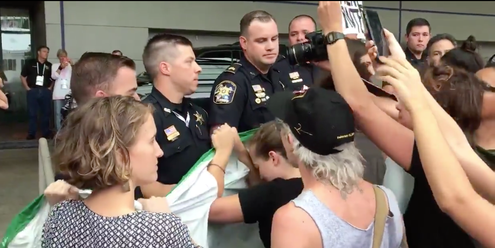 A ‘cursing’ truck driver hit a protester outside Jeff Sessions’ speech in New Orleans -- and he wasn't arrested