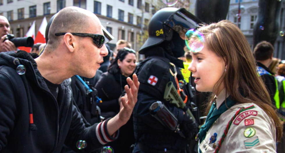 Powerful photo shows teenage Girl Scout standing up to angry neo-Nazi