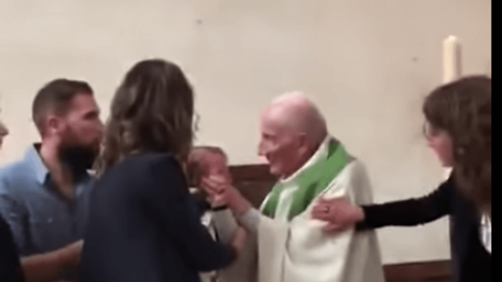 WATCH: Catholic priest slaps infant across the face before baptizing him