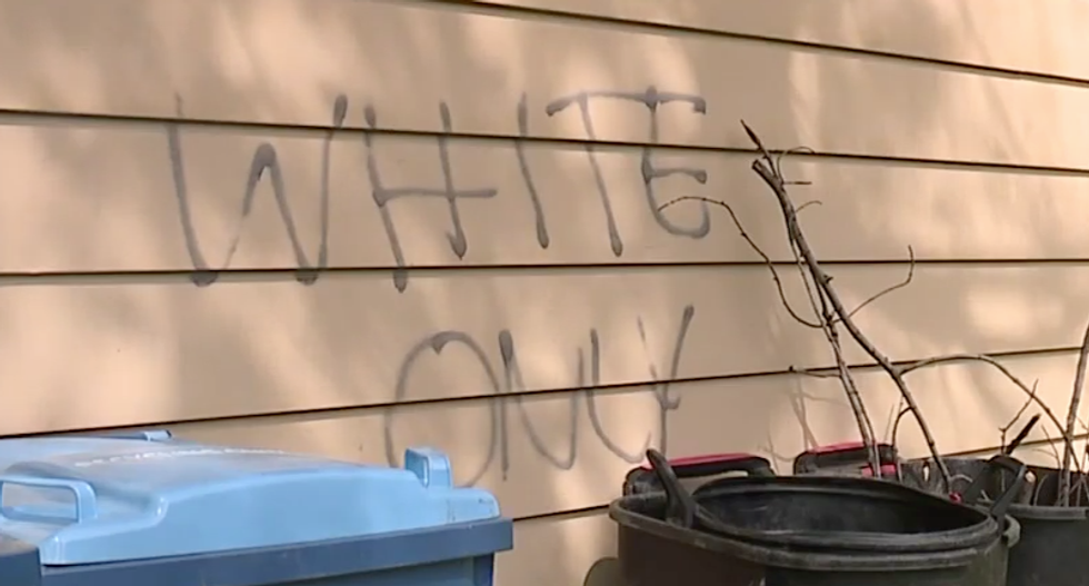 Bi-racial Ohio couple woke up to a lynched toy monkey, racist 'get out' comments spray painted on their house
