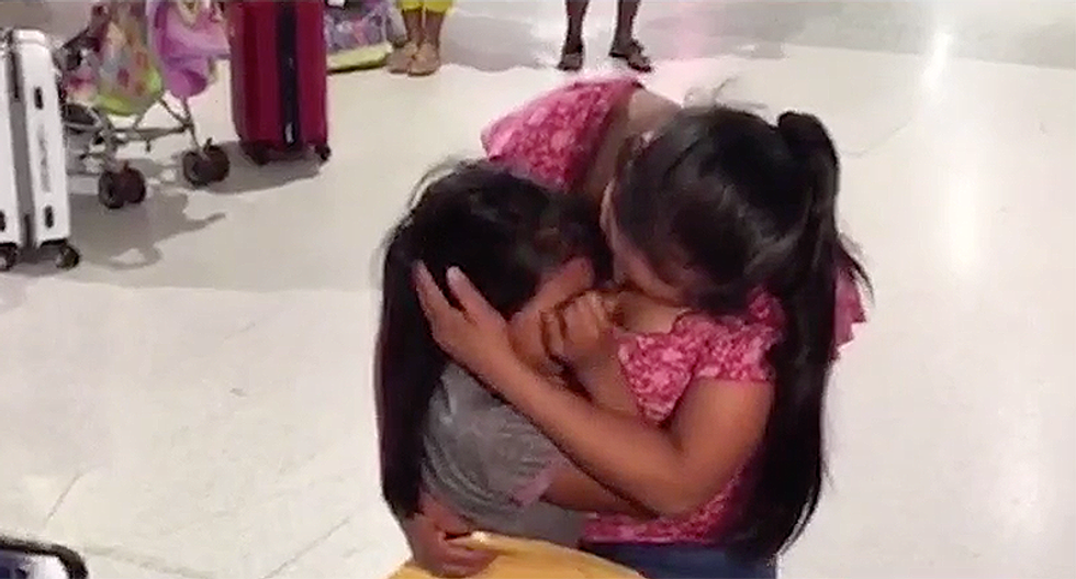 Migrant daughter doesn't want to let go after finally being reunited with her mother after 60 days