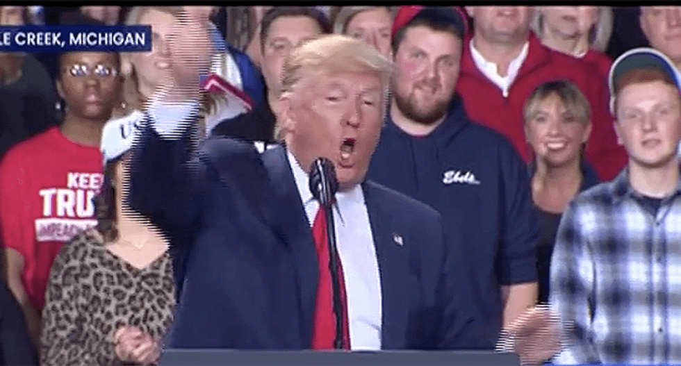 WATCH: Protester gives Trump the finger at rally as security drags him out over ‘you’re fired’ banner