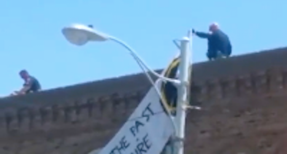 Marines arrested after displaying white nationalist banner at pro-Confederate rally