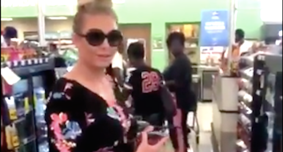 Eavesdropping white woman threatens to call cops on black woman: ‘We’re going to build this wall’