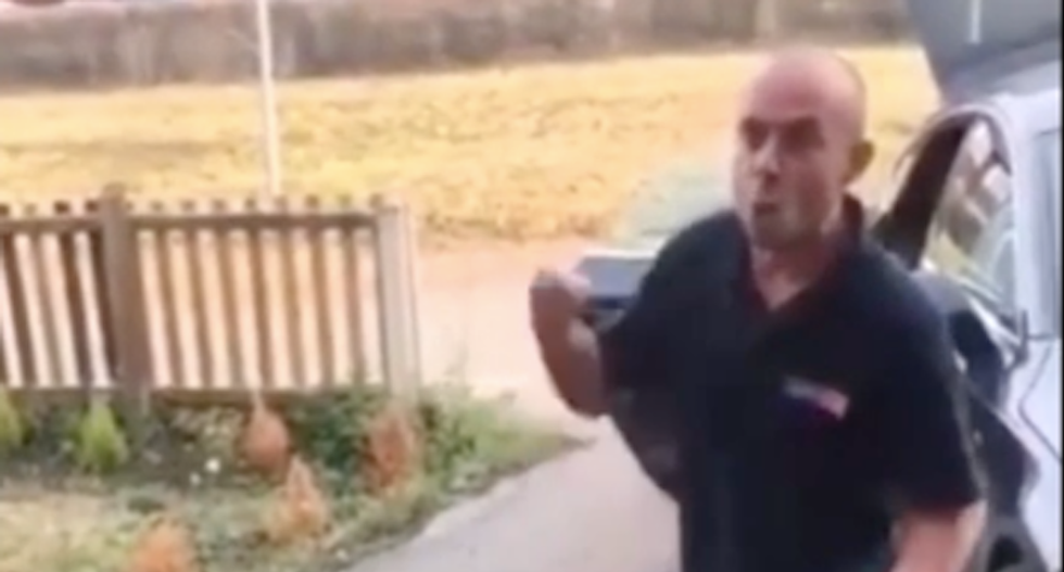 WATCH: Raging white man screams racist abuse at woman -- and mocks her for having black nephews