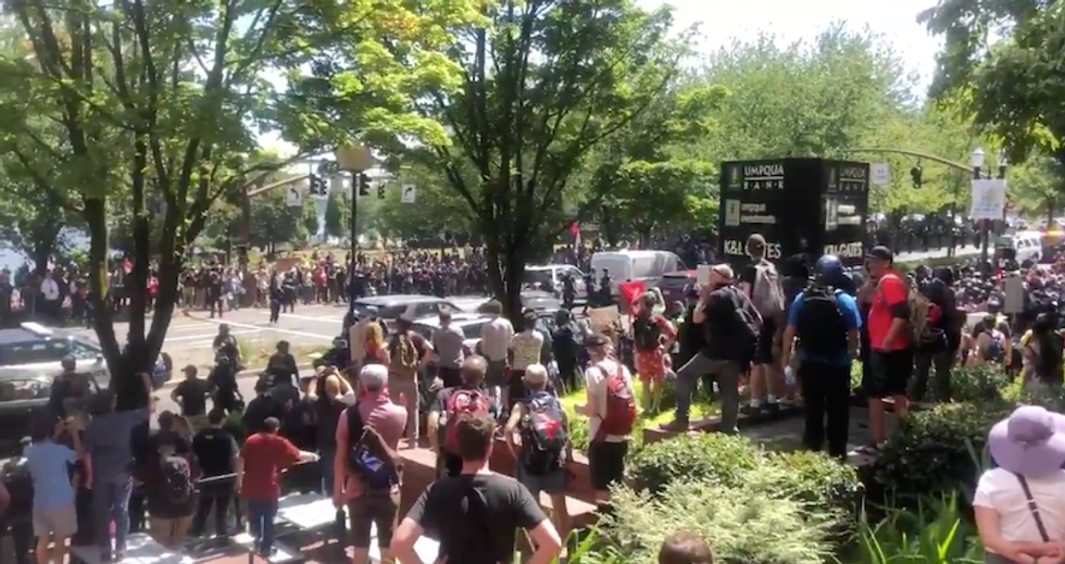 Watch: Portland police charge Antifa and fire smoke bombs after claiming they 'threw rocks and bottles'