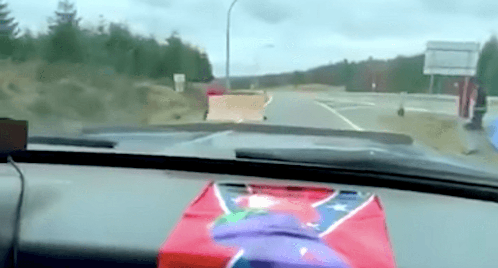 WATCH: Truck runs through protesters' highway blockade while blasting Mötley Crüe