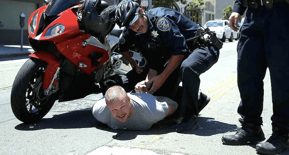 'Not racist' member of 'White Privilege Club' tries to run over Trumpcare protesters with motorcycle
