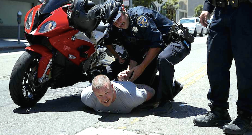 'Not racist' member of 'White Privilege Club' tries to run over Trumpcare protesters with motorcycle