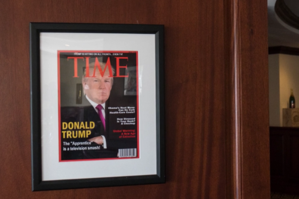 Trump's golf courses have framed copies of a fake Trump Time Magazine cover mounted on their walls