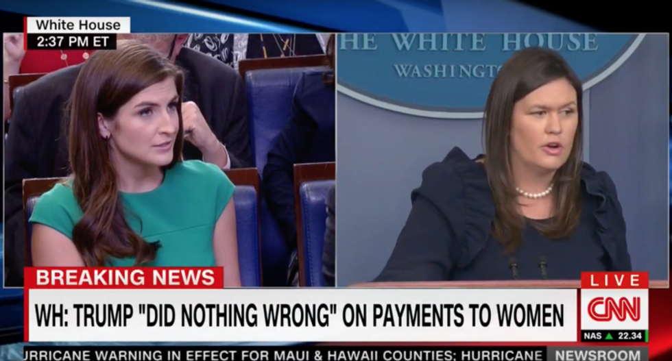 Sarah Sanders fumes as CNN reporter corners her for not explaining Trump's contradictory Cohen comments