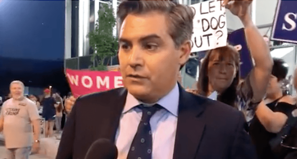 Watch CNN's Jim Acosta politely school Infowars reporter on the First Amendment