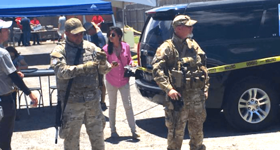 ‘No need for semi-automatic weapons’: Protesters intimidated by Texas militia at GOP governor’s event