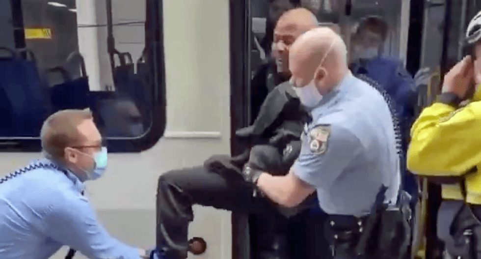 WATCH: Video shows pack of police forcibly remove man from a city bus -- for not wearing a mask