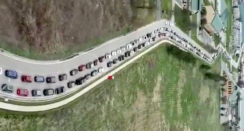 ‘Unforgettable’ footage of endless lines of cars at food banks illustrates coronavirus crisis in the US