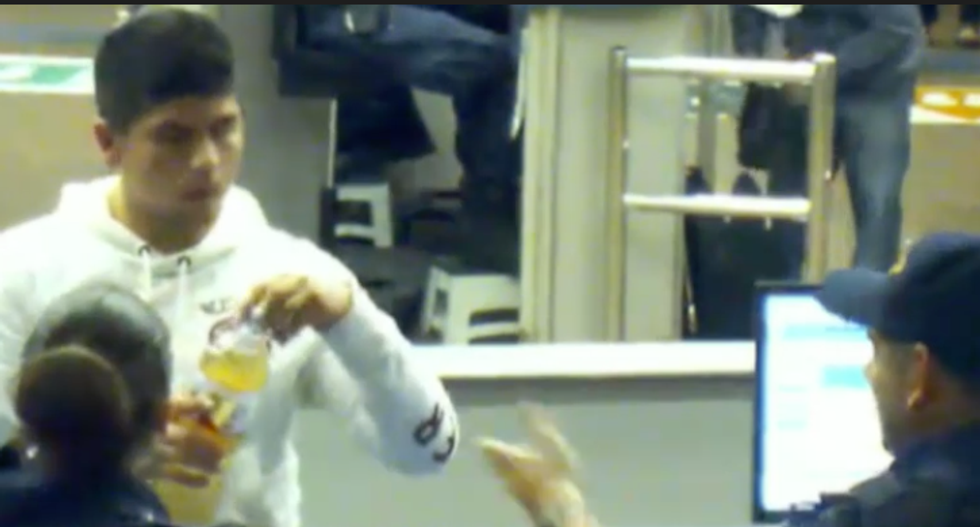 WATCH: Disturbing footage shows two border control agents encourage a teen to drink liquid meth to his death