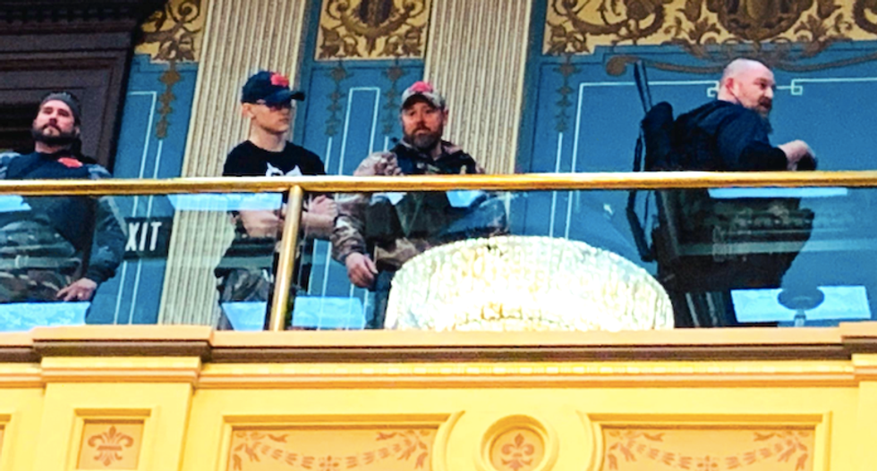 Michigan lawmakers wear bulletproof vests as protection against angry gun-toting protesters