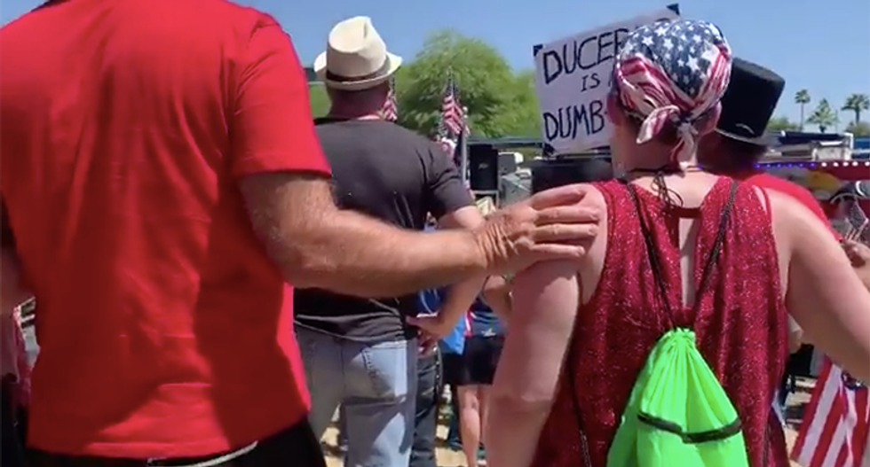 Arizona reopen rally ends with people joining hands and touching each other while singing 'Amazing Grace'