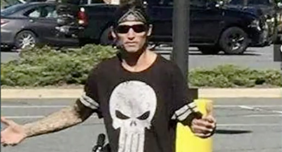 North Carolina men threaten black campaign worker with a gun in racist assault at early voting location